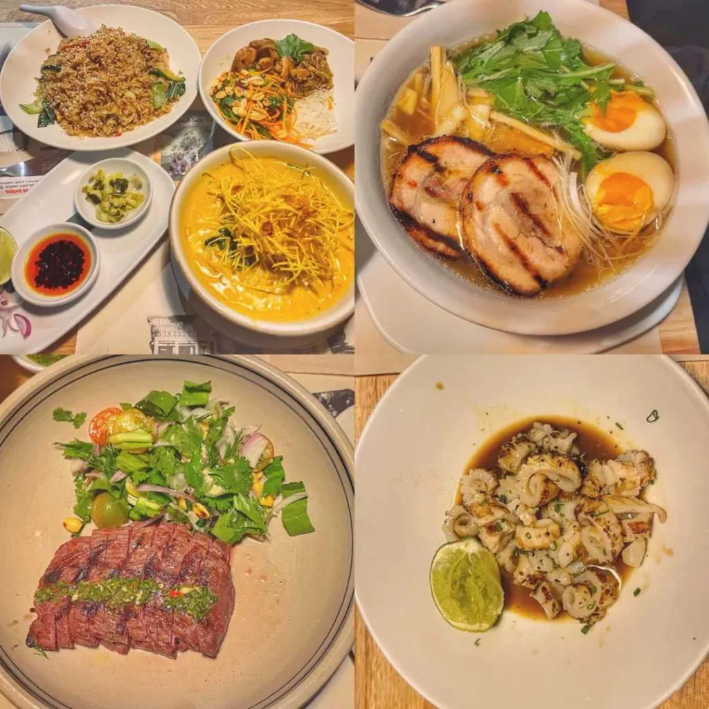 Variety of dishes including ramen noodles, grilled steak with herbs, and Asian-Colombian fusion cuisine on restaurant table