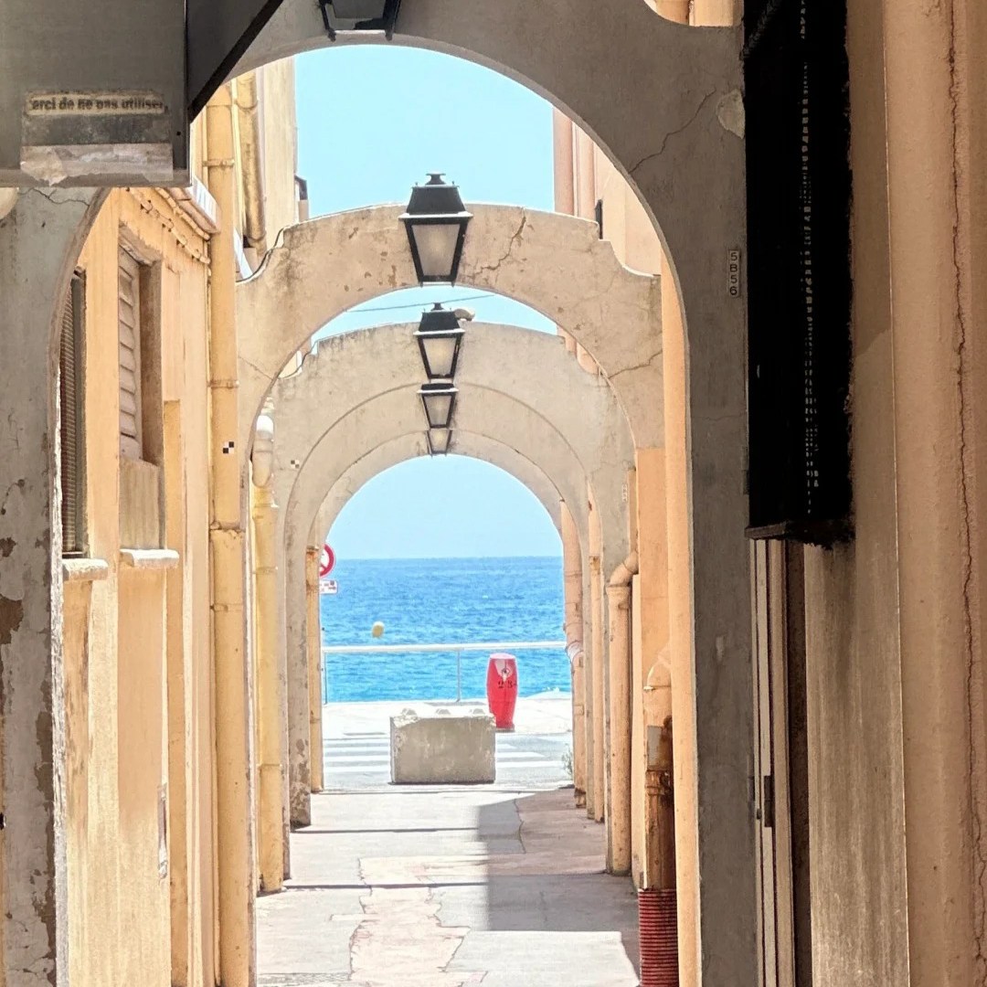 Europe travel coastal destination with traditional Mediterranean arches and sea view