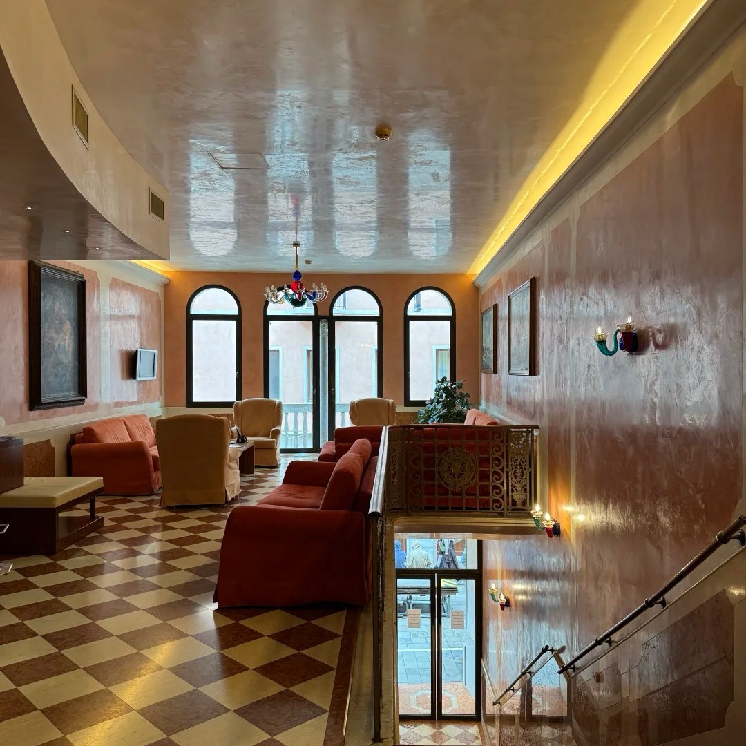 Elegant Europe travel hotel lobby with Venetian-style decor and premium amenities