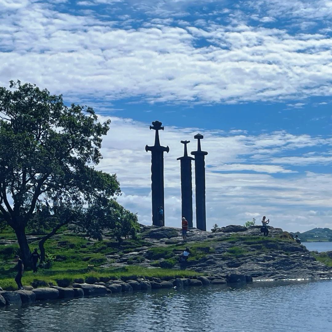 Norway drive cultural landmark featuring three giant Viking sword monuments on rocky coastline near Stavanger