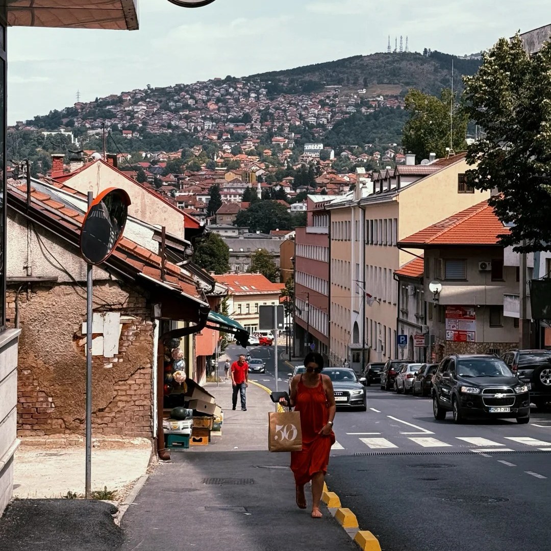 Solo female travel woman walking safely on city street