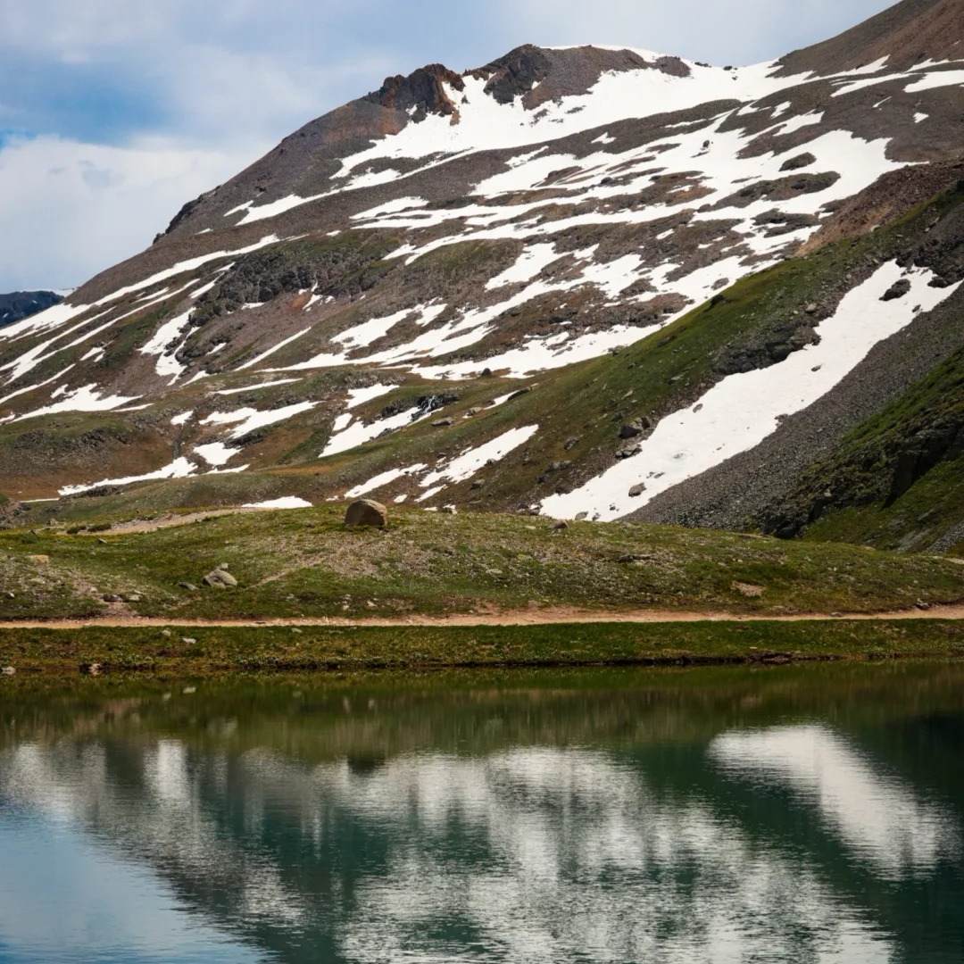 Solo female travel mountain lake with accommodation lodge