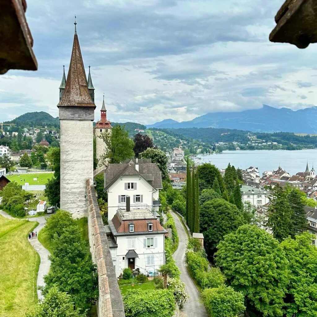 Switzerland travel tips historic tower overlooking lakeside town