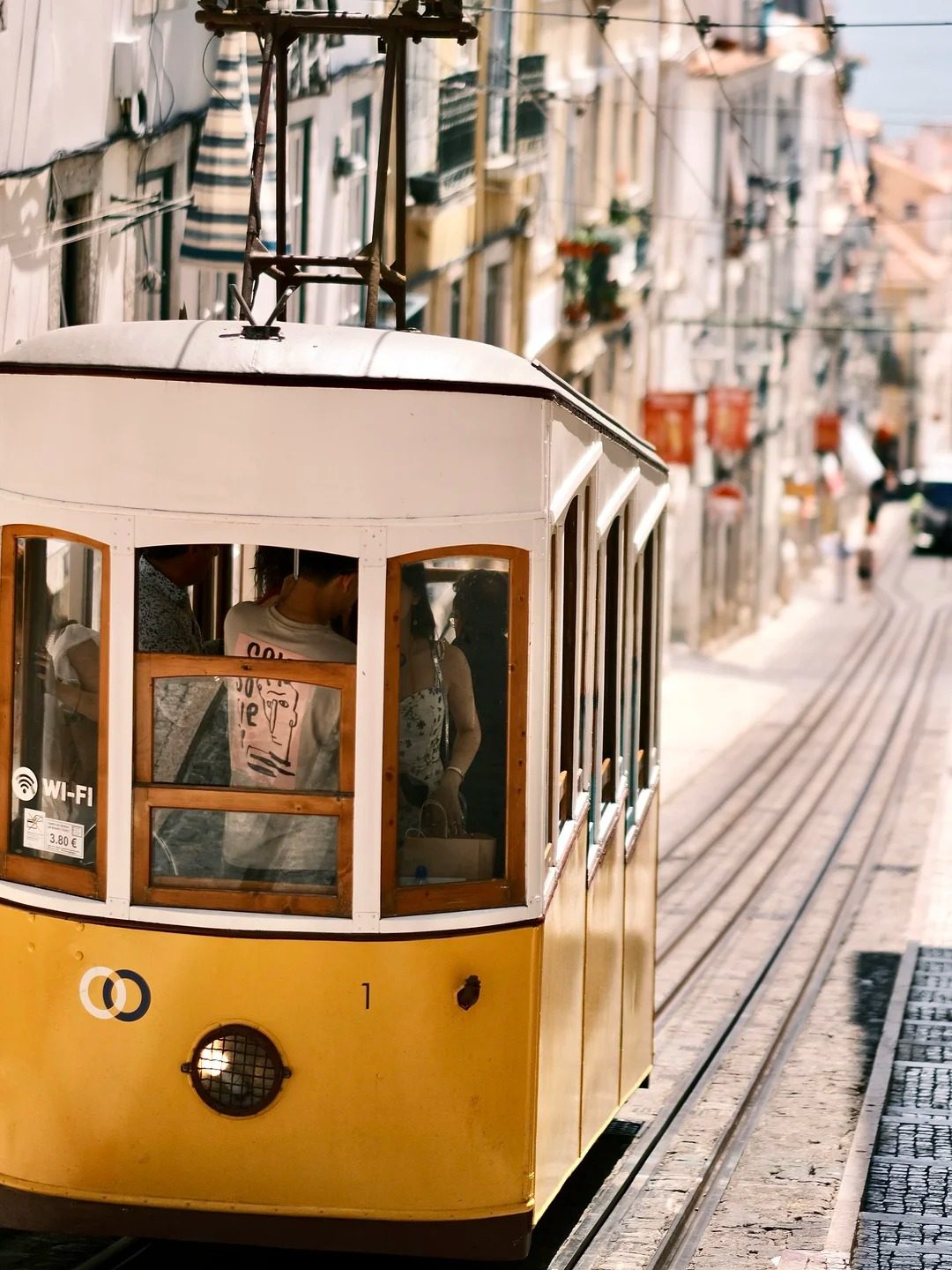 Travel inspiration vintage tram on European cobblestone street