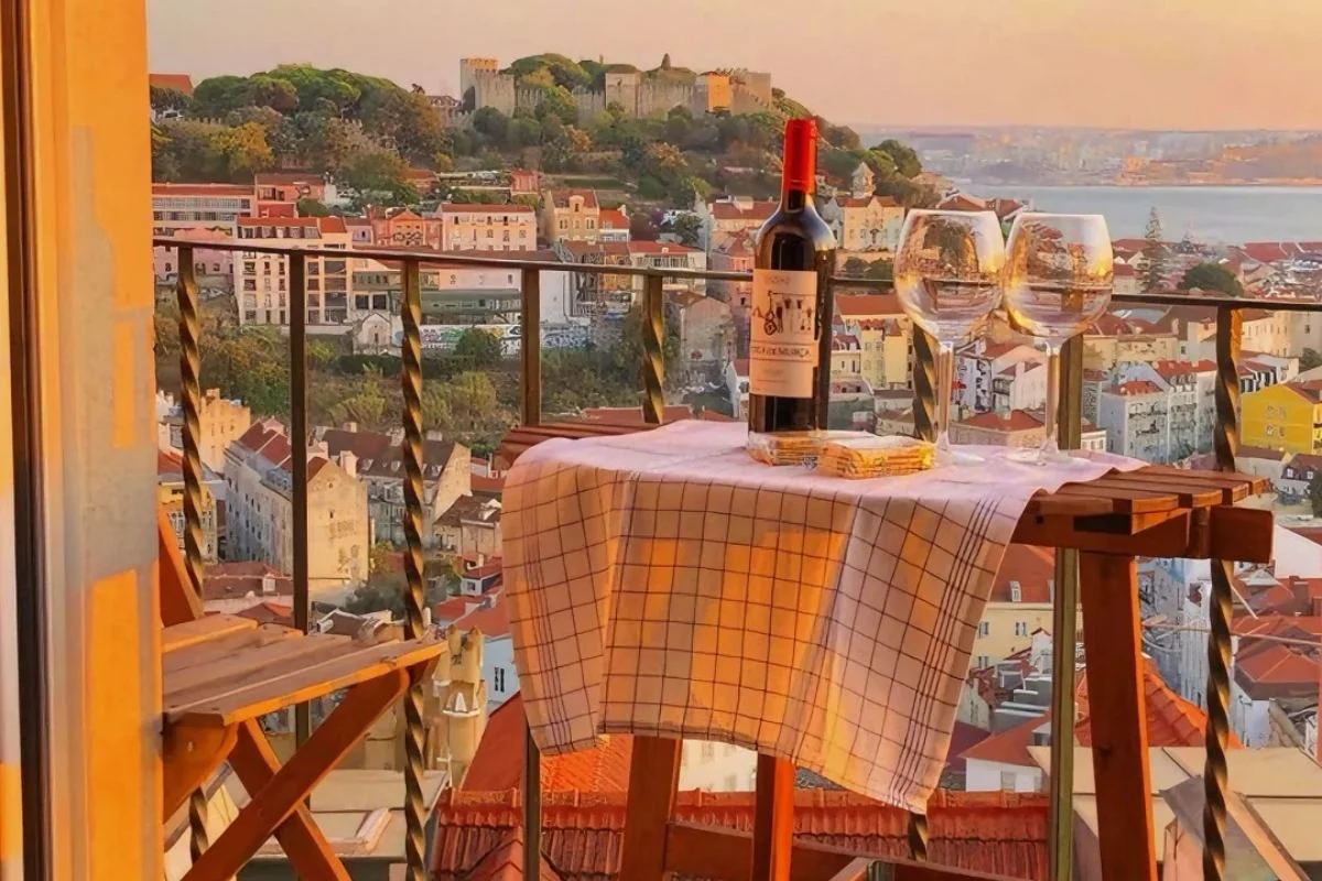 Lisbon sunset view from balcony, old town panorama, São Jorge Castle, Portuguese wine, romantic Lisbon cityscape, travel Portugal, becomeatraveller view