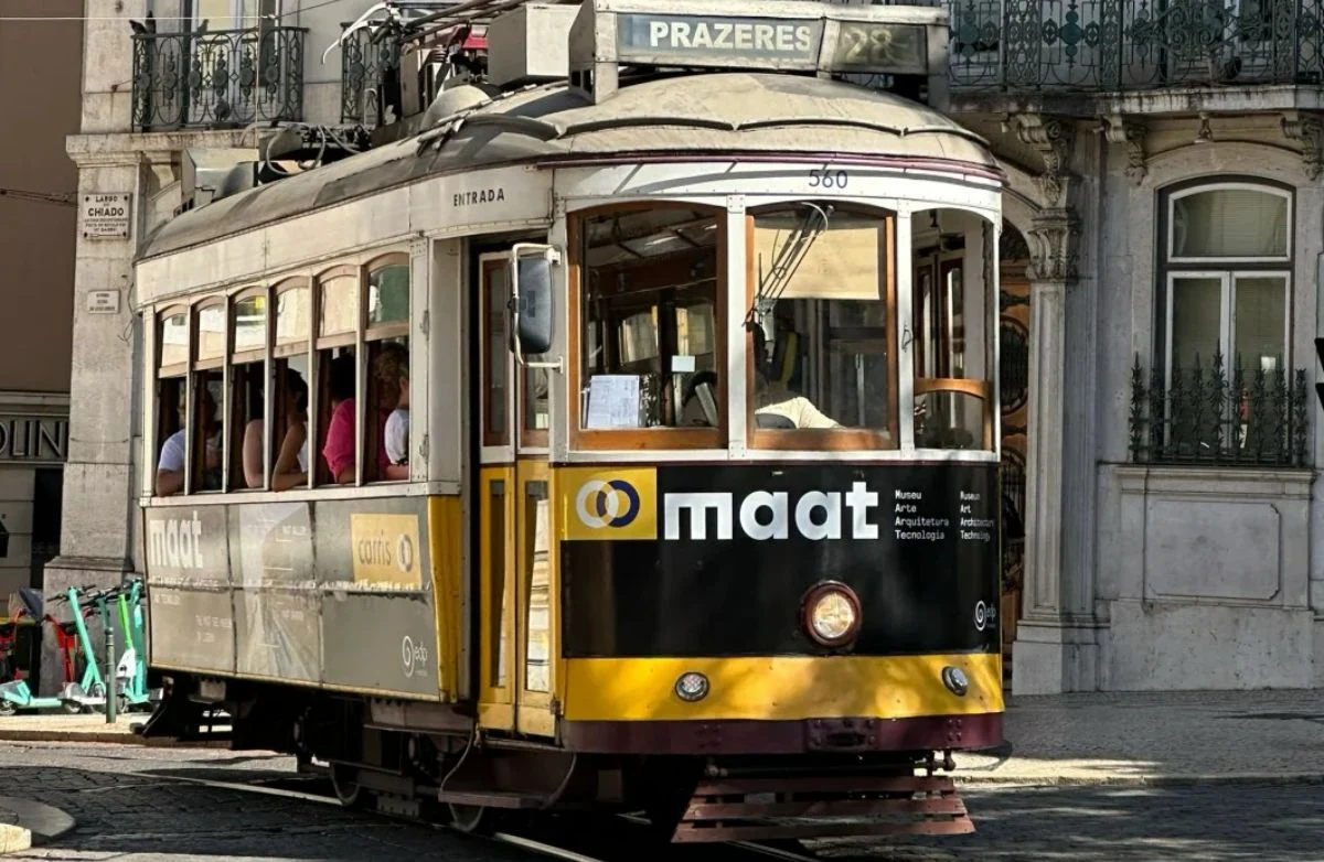 Lisbon’s iconic Tram 28 passing through Chiado, featured in Become A Traveller’s 2025 public transport guide