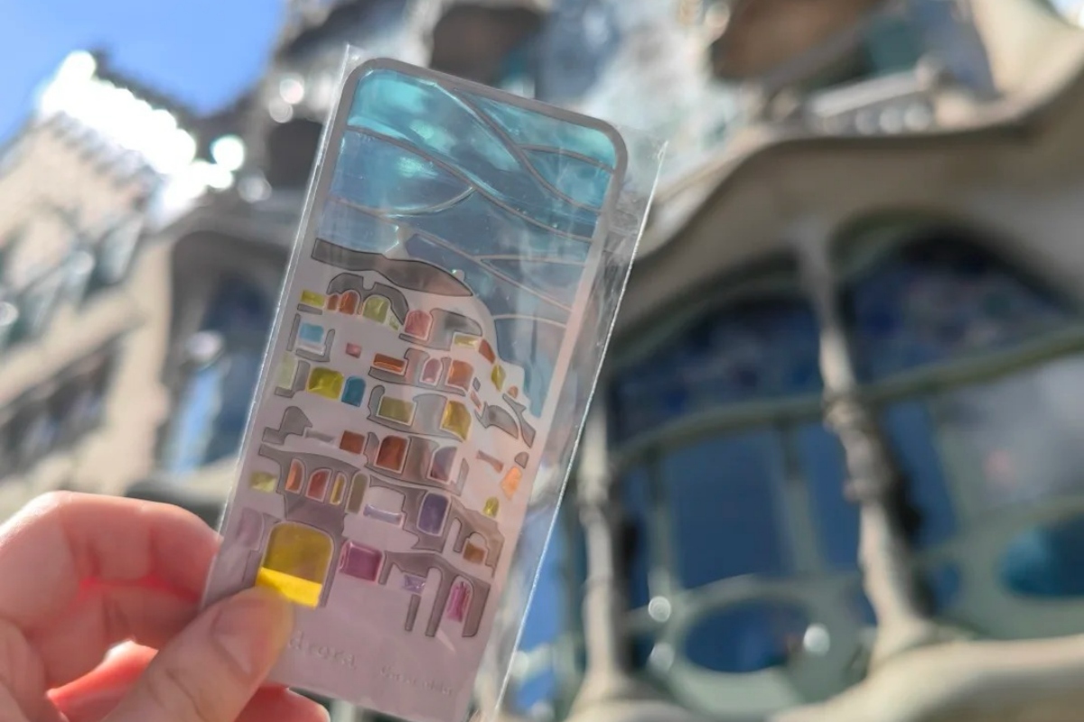 Creative Barcelona souvenir phone case featuring Casa Milà colorful design with iconic Gaudí architecture in background