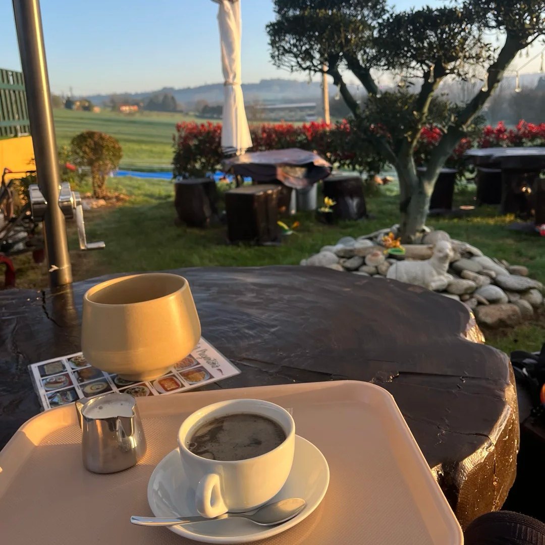 Coffee cup on terrace overlooking Spanish countryside along Santiago Ways